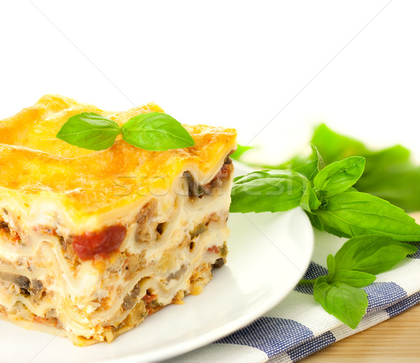 Delicious Italian Lasagna / with fresh basil / white background  Stock photo © Taiga