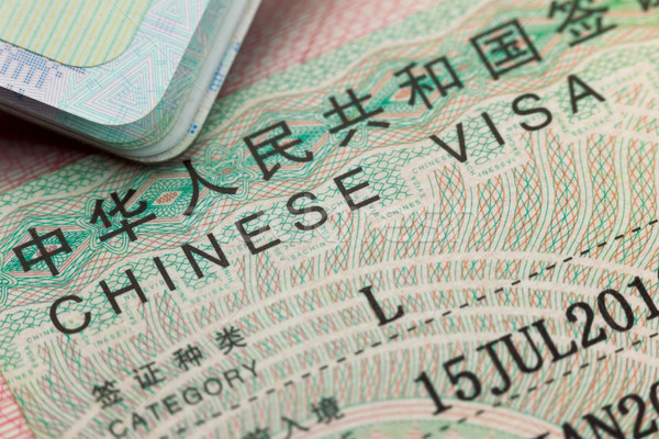 Chinese visa in a passport - enjoy travel  Stock photo © Taiga