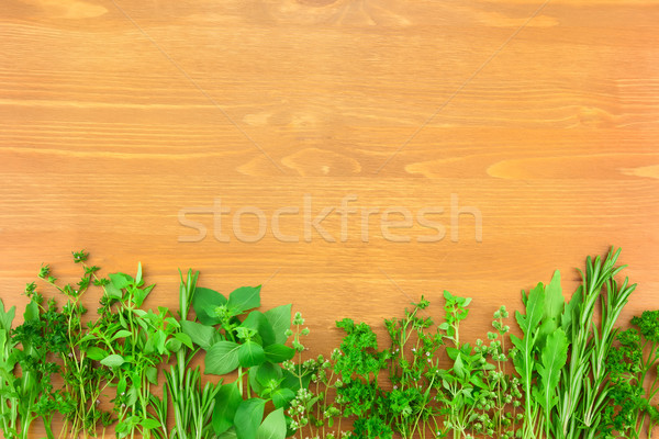 Border of Fresh  Herbs Collection on Vintage Wooden Table  Stock photo © Taiga