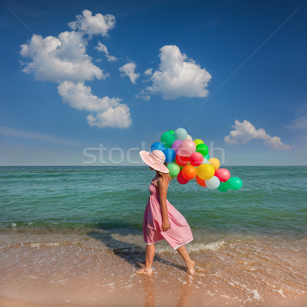 Young woman walking on the beach with colored balloons / Relax Stock photo © Taiga