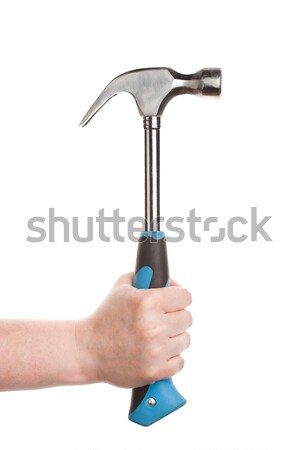 Female hand holding a hammer Stock photo © Taigi