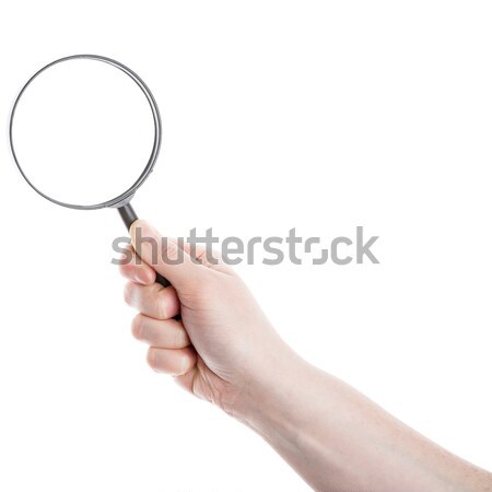 Hand holding magnifying glass Stock photo © Taigi
