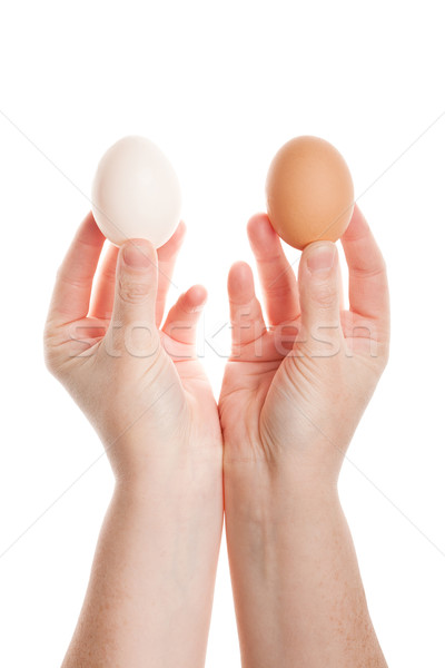 Stock photo: Female hands with eggs