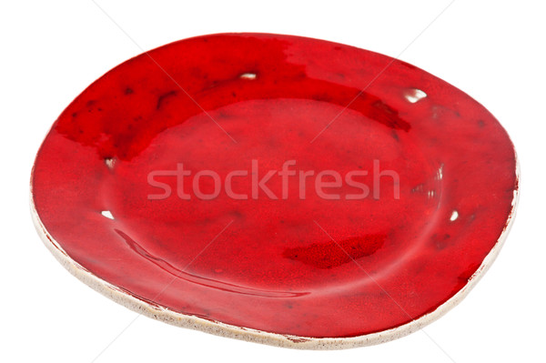 Red handmade pottery plate Stock photo © Taigi