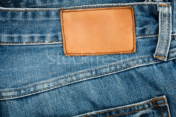 Blank leather jeans label sewed on a blue jeans  Stock photo © Taigi