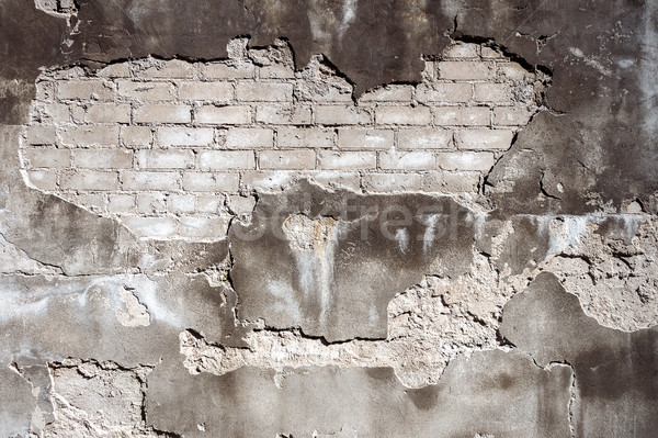 Old gray brick and plaster wall texture background Stock photo © Taigi