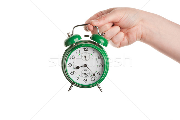 Hand holding alarm clock Stock photo © Taigi