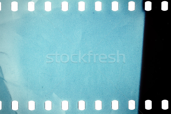 Vechi grunge filmstrip zgomotos albastru Filmul benzi Imagine de stoc © Taigi