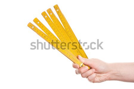 Hand holding wooden folding  ruler Stock photo © Taigi