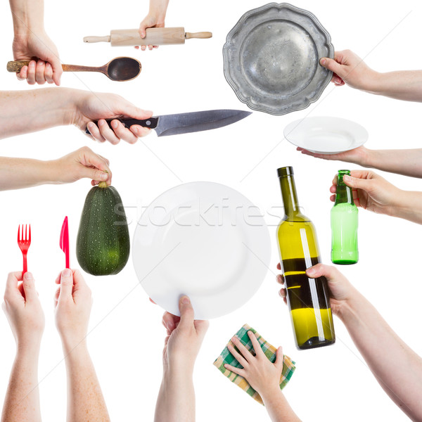 Stock photo: Hands holding various kitchen utensils