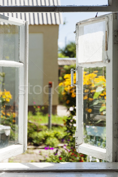 View from an old rural window in a sunny summer courtyard Stock photo © TanaCh