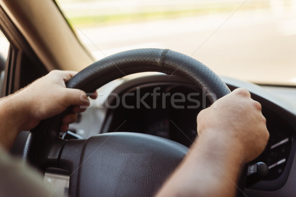 man's hands on the steering wheel retro toning car Stock photo © TanaCh