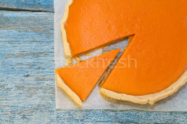 Bright pumpkin tart, flan, in the context of cream Stock photo © TanaCh