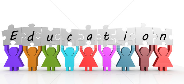 Stock photo: Holding word Education split over different puzzle pieces