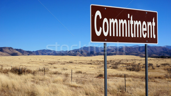 Commitment brown road sign Stock photo © tang90246