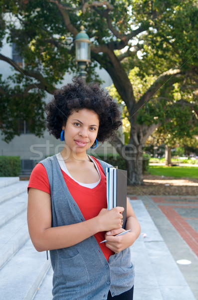 Studente outdoor libro di testo african american ragazza campus Foto d'archivio © tangducminh