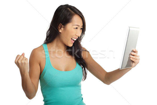 Izgalmas ázsiai nő izgatott digitális tabletta Stock fotó © tangducminh