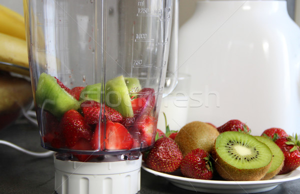 Fresh fruits in the blender  Stock photo © tannjuska