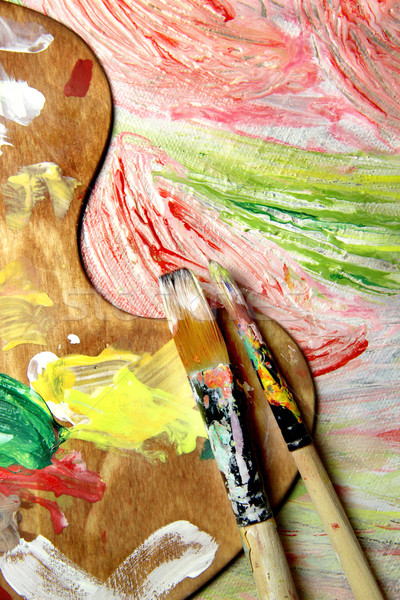 Art palette, paintbrushes and picture with flowers Stock photo © tannjuska