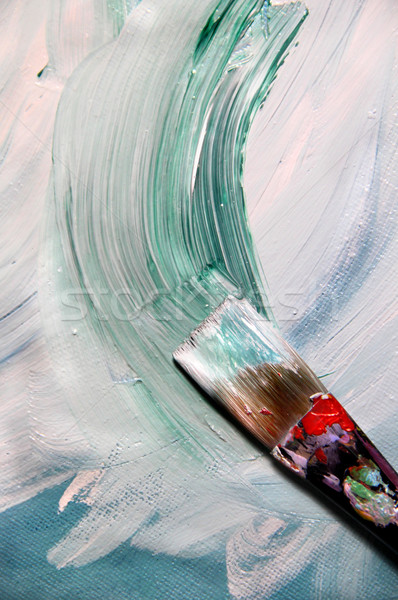 Mixing painting on the canvas and paintbrush Stock photo © tannjuska