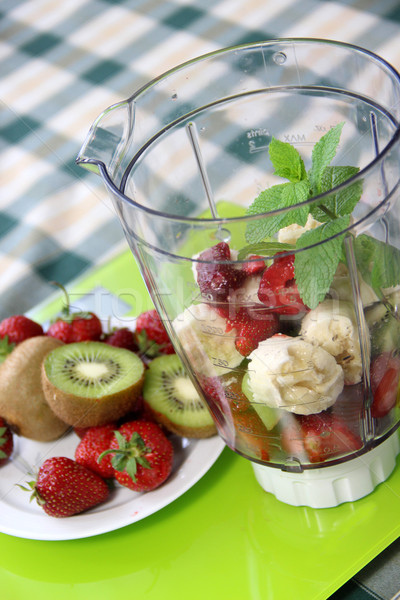 Fresh fruits in the blender  Stock photo © tannjuska