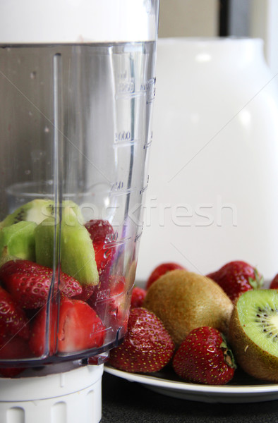 Fresh fruits in the blender  Stock photo © tannjuska