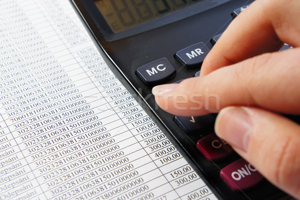 Office table with calculator, pen and accounting document   Stock photo © tannjuska