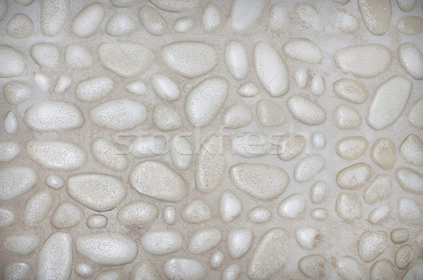 textured stone wall background with small stones and cement  Stock photo © tarczas