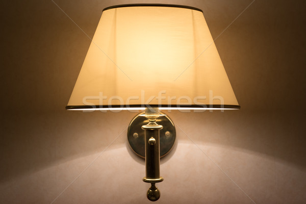 Wall lamp with yellow shade from canvas Stock photo © tarczas