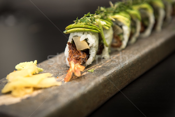 Sushi rolls with prawns on a stone plate Stock photo © tarczas