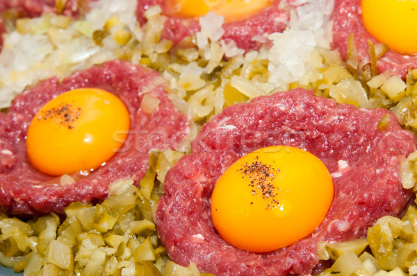 tartar steak with egg onion and pickle Stock photo © tarczas