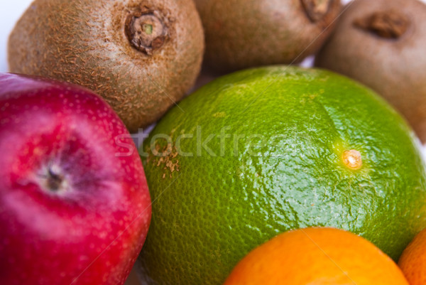 fruits orange apple kiwi kaki pear grapefruit Stock photo © tarczas