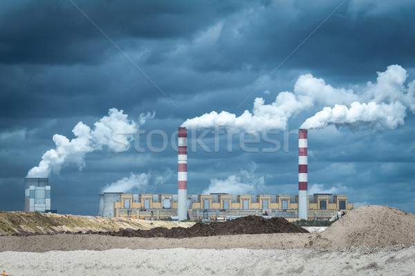 Coal ower plant smokestacks emitting smoke by chimneys Stock photo © tarczas