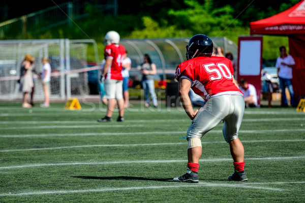 american football player with out of focus players in the background  Stock photo © tarczas