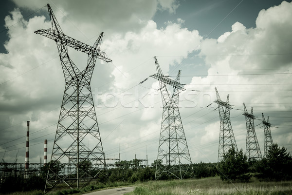 Pylon and transmission power line in summer day Stock photo © tarczas