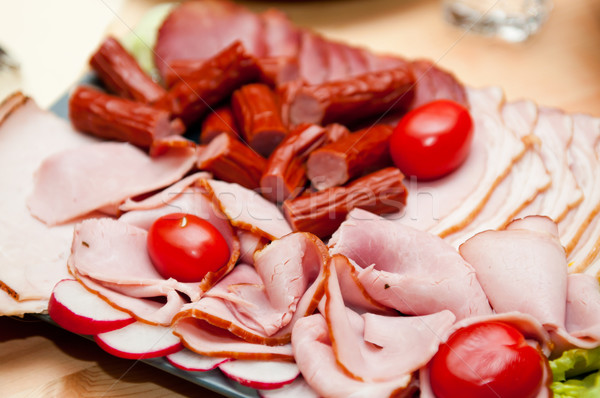 Stock photo: platter of cold cuts and sausages with ham and tomatoes