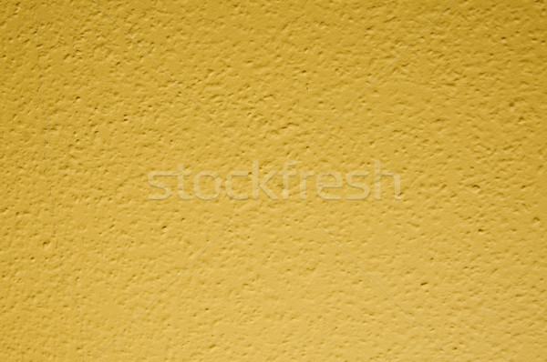 pale yellow structural painted wallpaper on the wall Stock photo © tarczas