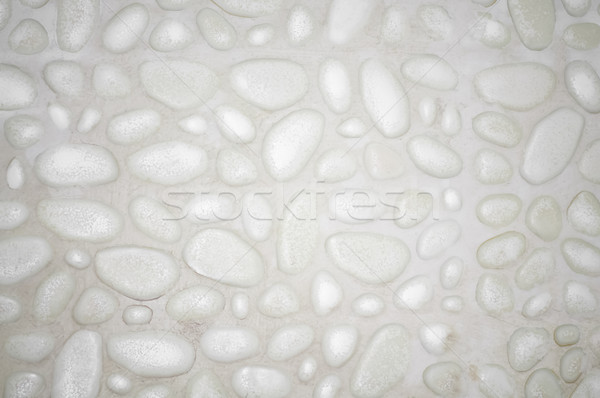 textured stone wall background with small stones and cement  Stock photo © tarczas