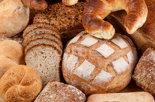 Group of different bread's type on wooden table Stock photo © tarczas