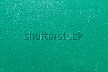 green structural painted wallpaper on the wall Stock photo © tarczas