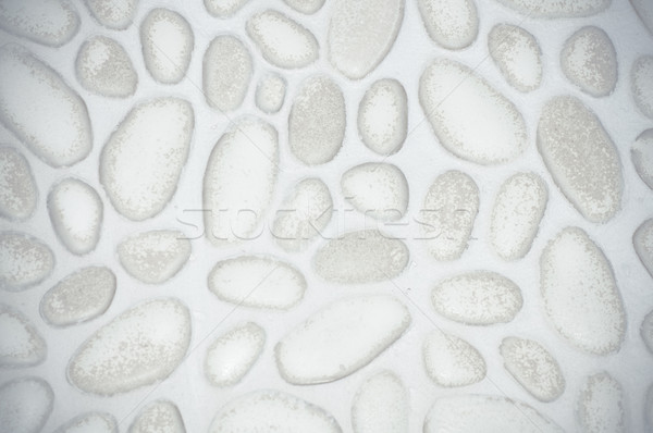 textured stone wall background with small stones and cement  Stock photo © tarczas