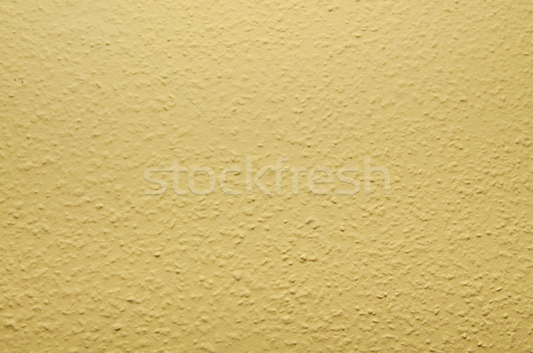 pale yellow structural painted wallpaper on the wall Stock photo © tarczas