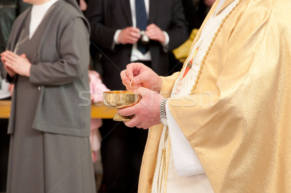 Catholic priest granting the Communion Stock photo © tarczas