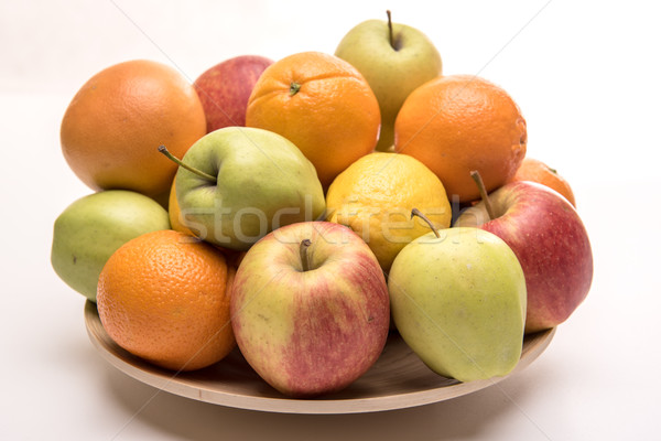 Tasty fruit orange, apples and banana on the wooden plate Stock photo © tarczas