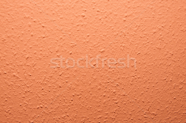 orange structural painted wallpaper on the wall Stock photo © tarczas