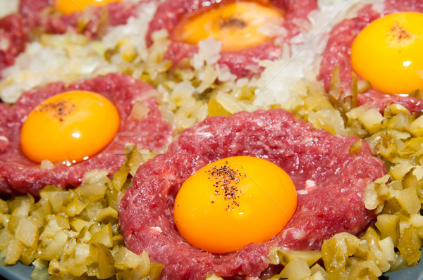 tartar steak with egg onion and pickle Stock photo © tarczas