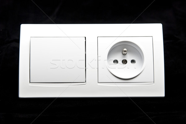 white electric switch and socket combination on black background Stock photo © tarczas