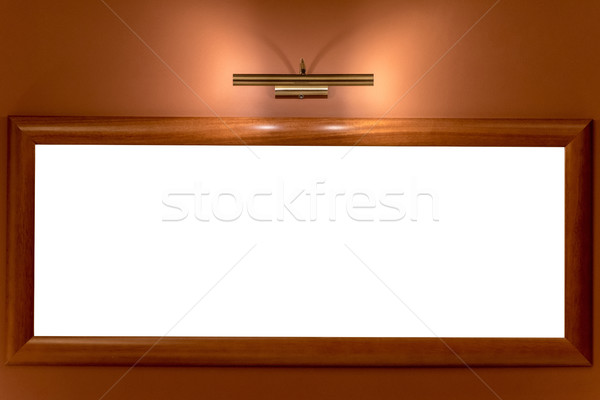 picture frame illuminated by lamp on the wall Stock photo © tarczas