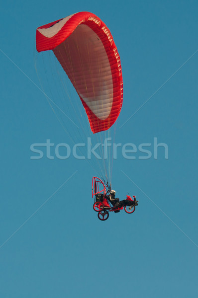 red paraglider on the clear blue sky Stock photo © tarczas