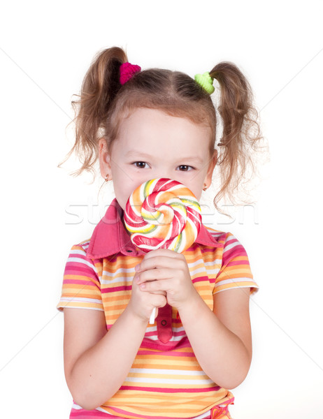 Cute little girl holding big lolly pop Stock photo © TarikVision